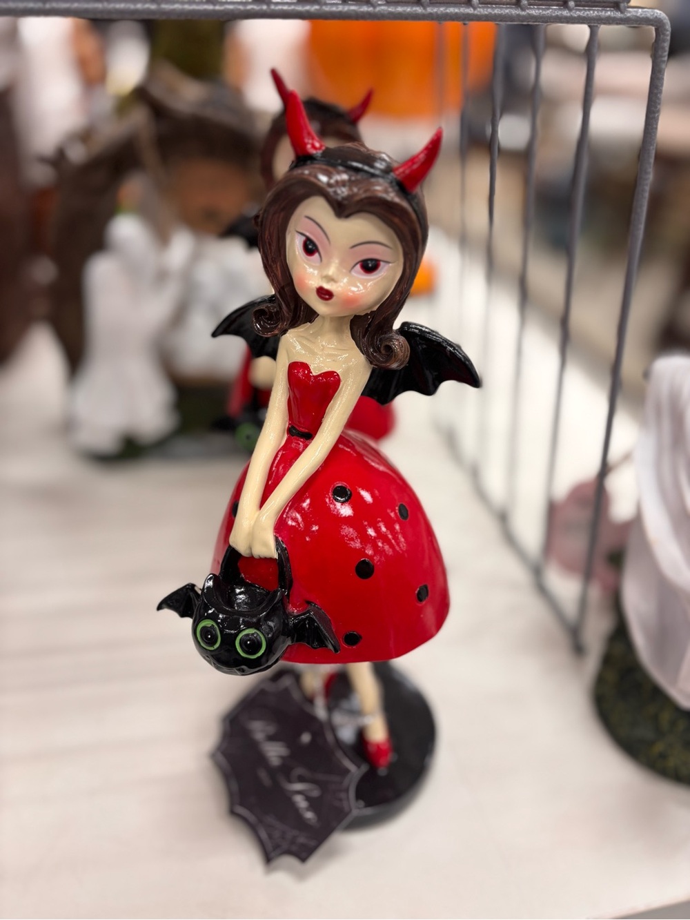 Red Devil Girl Figurine with Bat Accessory